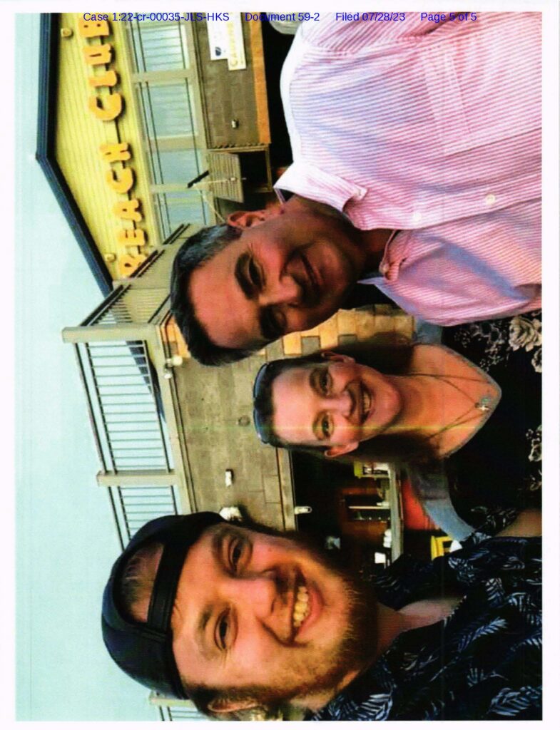 an image of luke wenke and his mommy with senator george borrello sent with unwanted email to cyberstalking victim's business partner