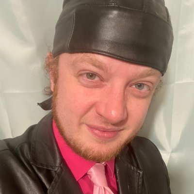 luke wenke white male leather cap red shirt ugly