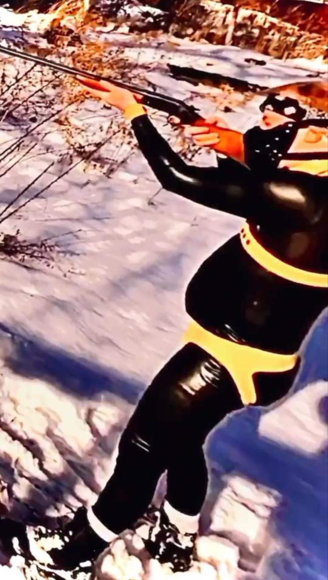Luke Wenke shooting a gun in the woods while wearing a latex bdsm gimp suit