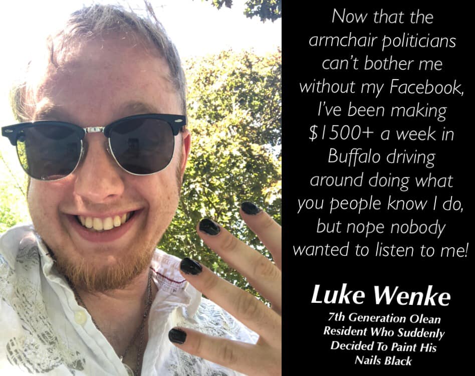 photo of luke wenke in sungalsses while showing off black painted nails